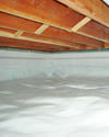 a moisture barrier installed on the walls and floors of a crawl space in Medford