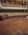 Crawl space drainage matting installed in a home in Concord