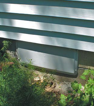 A gray crawl space vent cover in Arlington