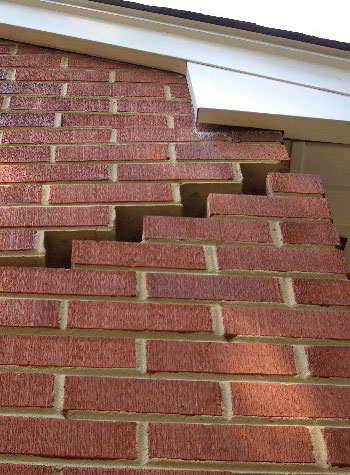 photo of a rotating foundation wall with cracks in Lexington
