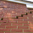 stair step cracking on a foundation wall in Lowell