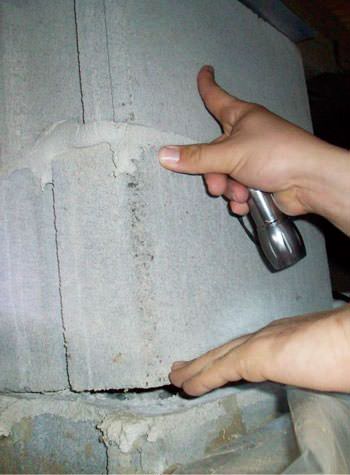 a completely failing concrete crawl space support pillar in Watertown