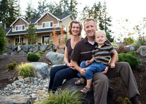 A happy family outside a home with a repaired foundation in Andover