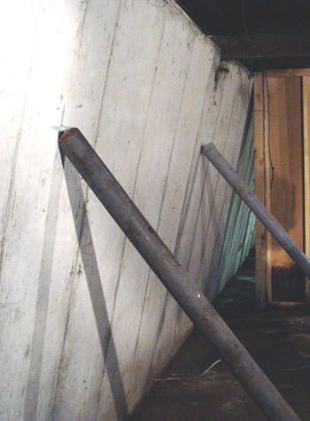 A foundation wall leaning in at the top in Tewksbury