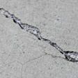 sinking outdoor concrete in need of mudjacking in Manchester