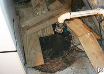 An ugly, clogged sump pump system in Somerville, Massachusetts and New Hampshire