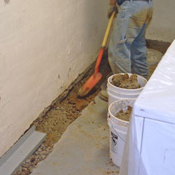 Digging a trench for a French Drain system in Manchester