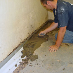 Testing a French drain system in a Malden home.