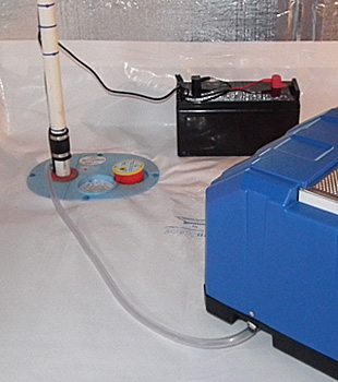 Closeup of a crawl space sump pump installed in Pembroke